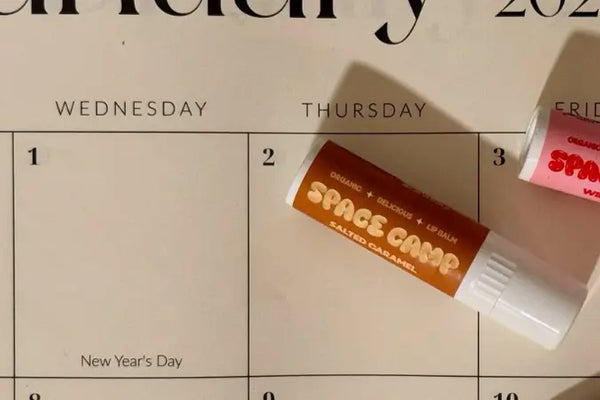Best lip balm flavors including salted caramel and wild cherry, displayed on a January 2025 calendar