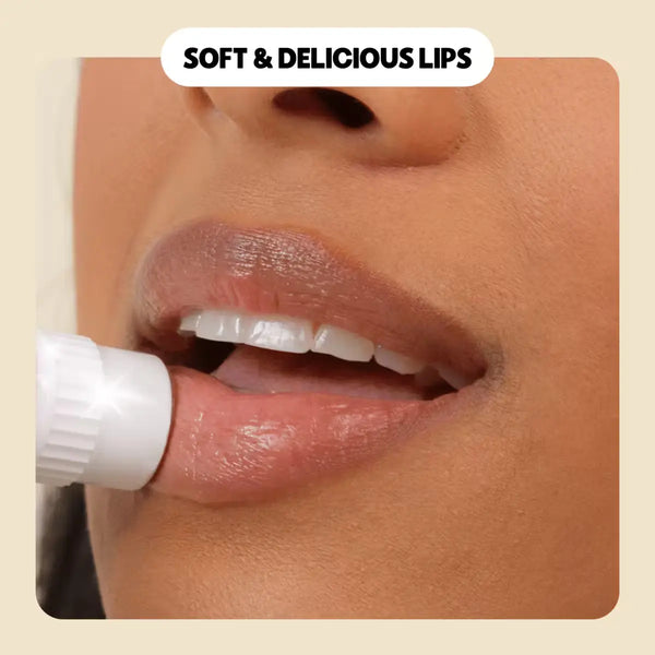 Close-up of a woman applying lip balm for soft & hydrated lips