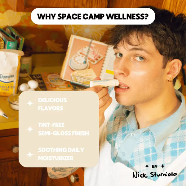 Man applying Space Camp Wellness lip balm in a retro kitchen with baking ingredients in the background