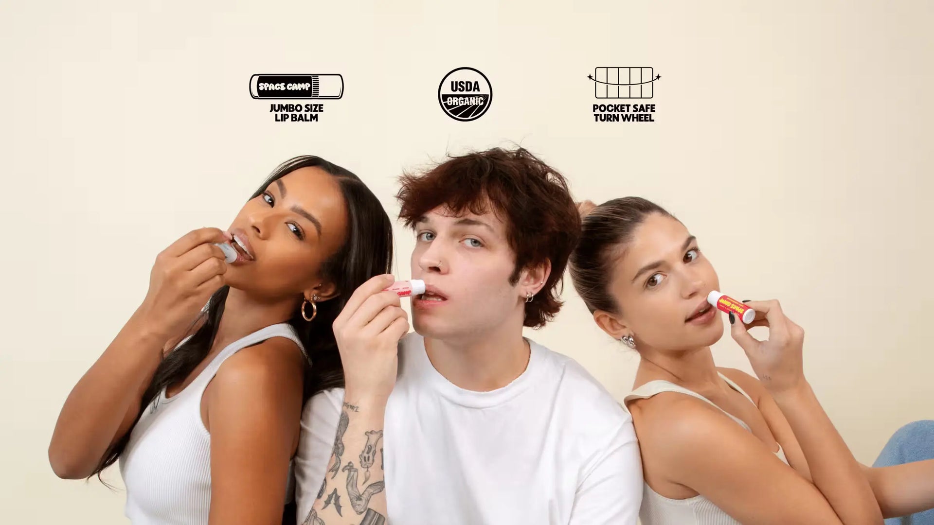  Three people applying organic jumbo-size lip balm, emphasizing USDA certification & pocket-safe turn wheel feature