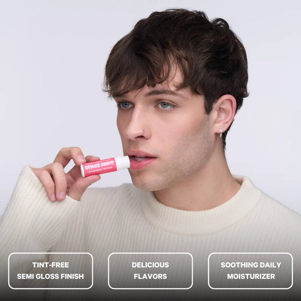A person applying Space Camp Strawberry Frosting flavored lip balm with feature callouts for tint-free finish, flavor, and daily moisturizer.