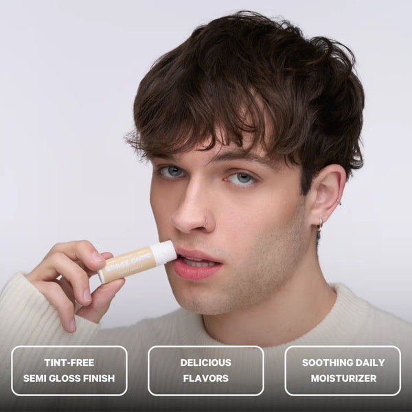 A person applying Space Camp vanilla lip balm with feature callouts for tint-free finish, flavor, and daily lip moisturizer.