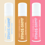 Space Camp organic lip balms in Birthday Cake, Salted Caramel, and Strawberry Frosting flavors displayed on pastel backgrounds.