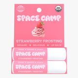Space Camp Strawberry Frosting hydrating lip balm jumbo size packaging with two tubes and a strawberry-topped frosting illustration.