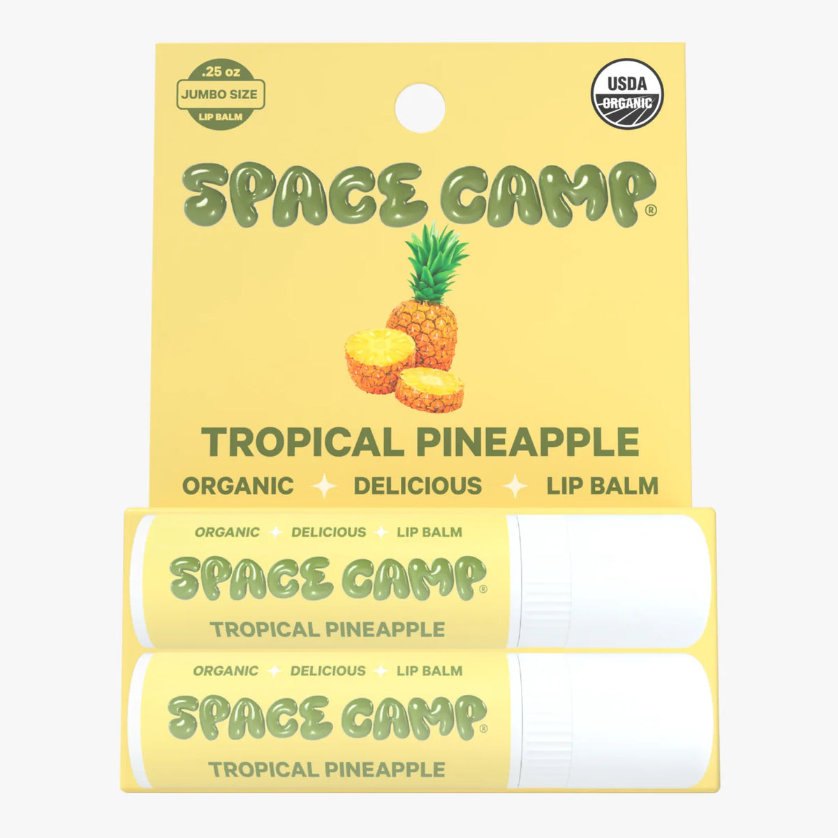 Space Camp Tropical Pineapple organic lip balm packaging with pineapple graphic, USDA Organic seal, and two jumbo-size tubes.
