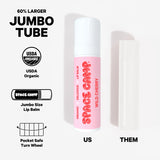 Space Camp Wild Cherry Lip Balm jumbo tube size comparison showing its 60% larger USDA Organic format versus a standard lip balm.