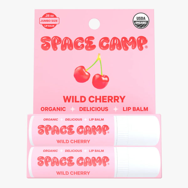 Space Camp Wild Cherry organic lip balm packaging with pink cherry graphics, USDA Organic seal, and two jumbo-size tubes.