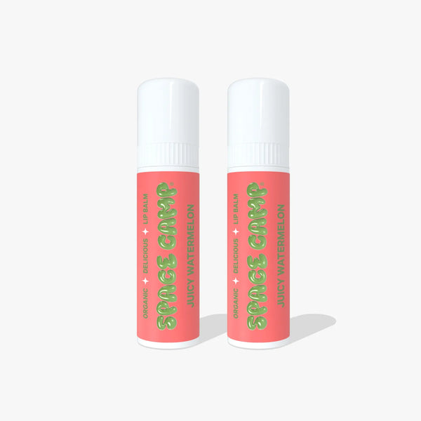 Two Space Camp Juicy Watermelon lip balm tubes with coral labels standing side by side on a white background.