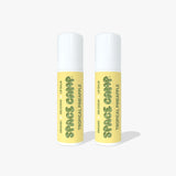 Two Space Camp Tropical Pineapple organic lip balm tubes with yellow labels and white caps on a white background.